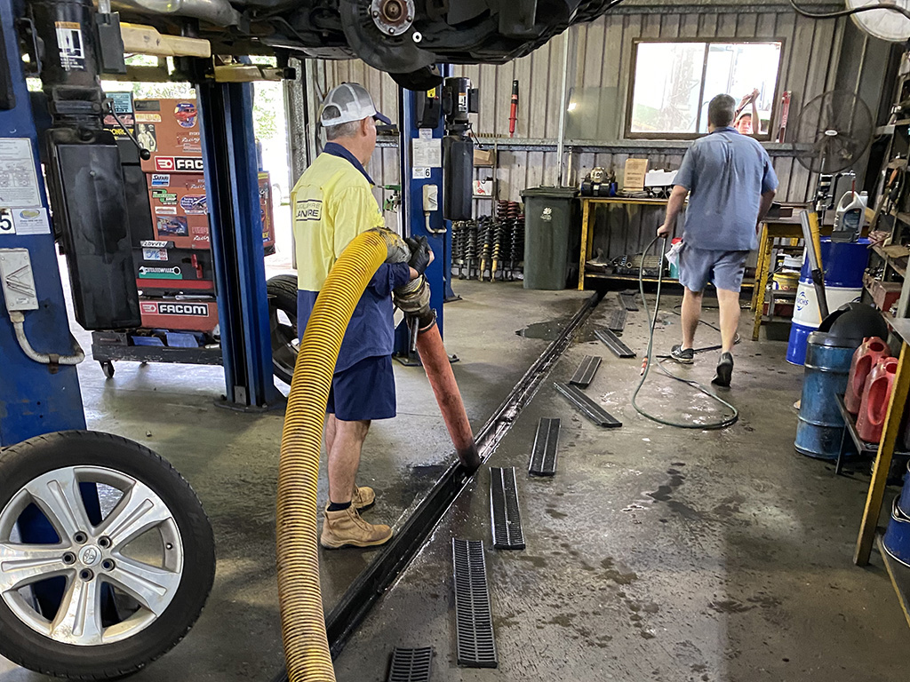 hydrovac truck sucking out drain
